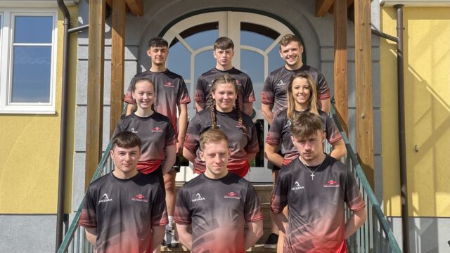 Junior Battle Team in Locken Austria wearing their red and grey Welsh Kit min